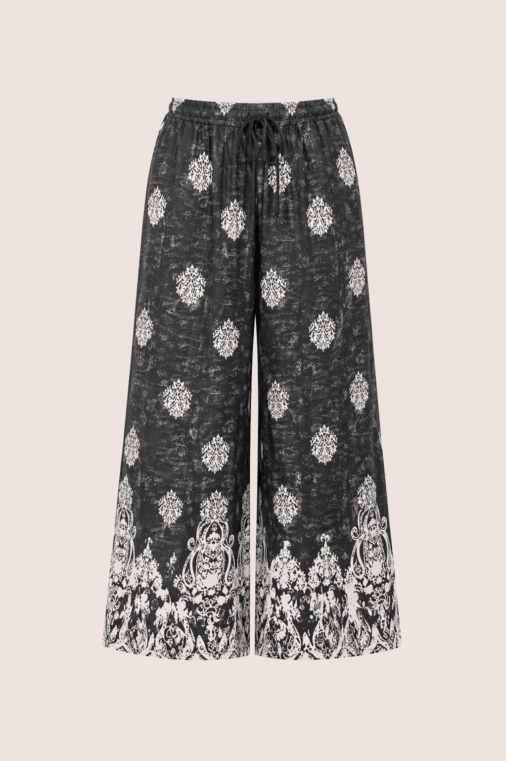 Pantalón negro con estampado étnico geométrico