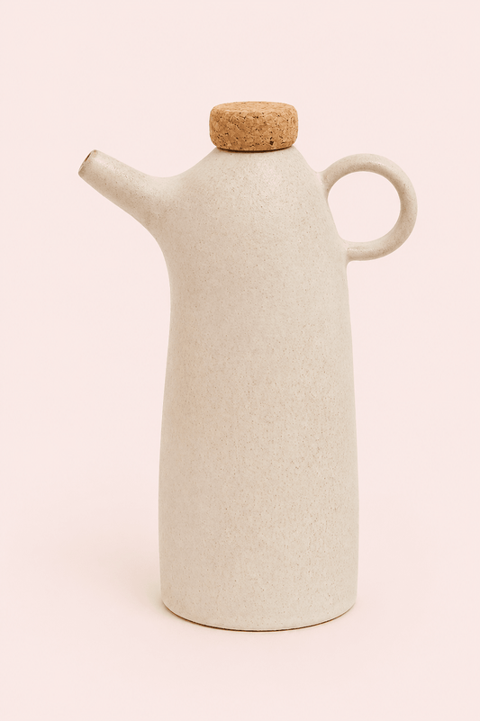 Botella de aceite de oliva de cerámica blanca con corcho