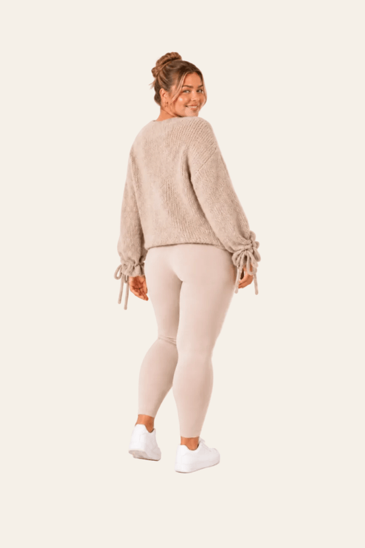 Knitted ladies' sweater with bow details on the sleeves