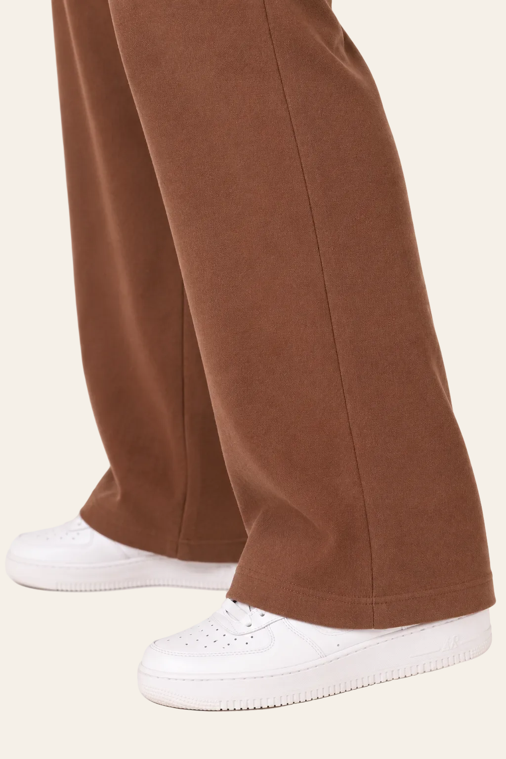 Elegant women's trousers with a high waist, wide legs, and side pockets