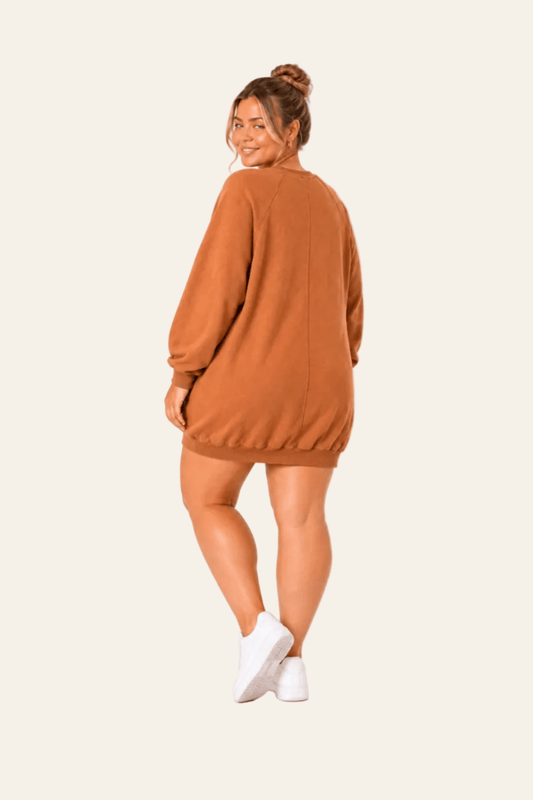 Long casual women's blouse with V-neck, jet stone print and hidden side pockets
