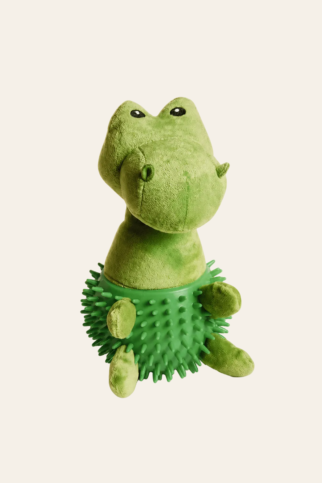 Neandno pluche dino met pieper op een lichtbeige achtergrond