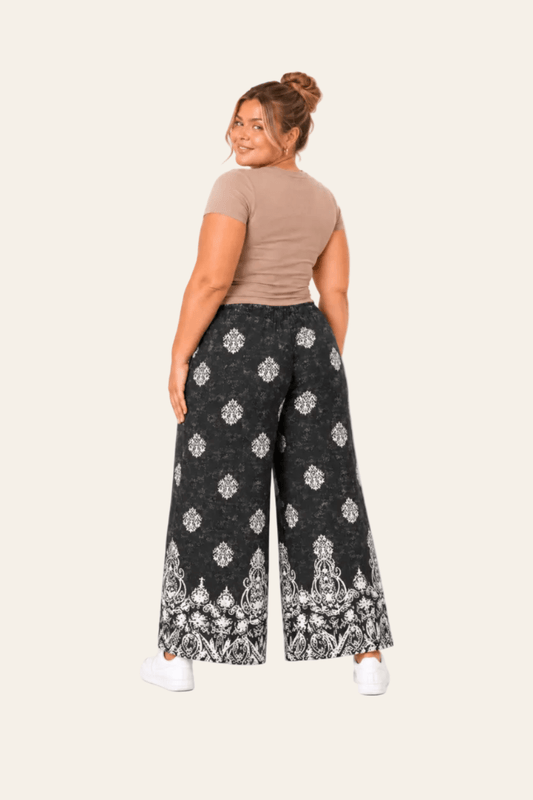 Black trousers with geometric ethnic print