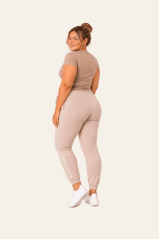 Sporty women's jogging bottoms with high waist and elasticated cuffs