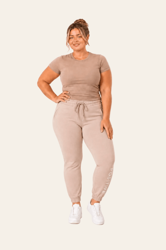 Sporty women's jogging bottoms with high waist and elasticated cuffs