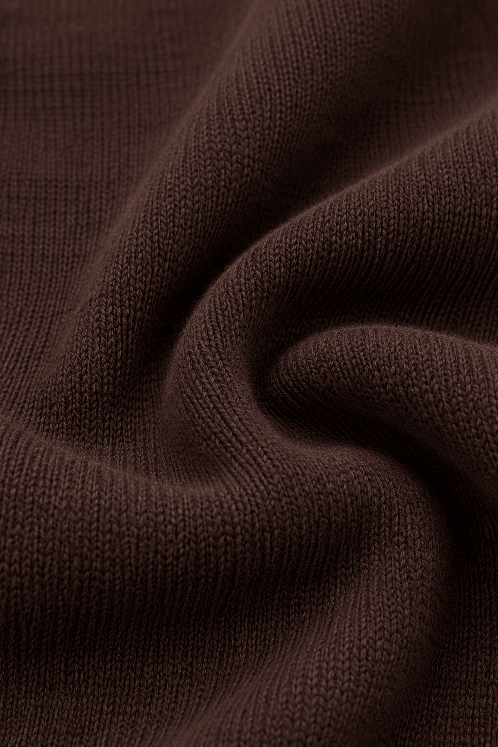Detail van de bruine breistructuur van de LMB Boutique oversized sweater.
