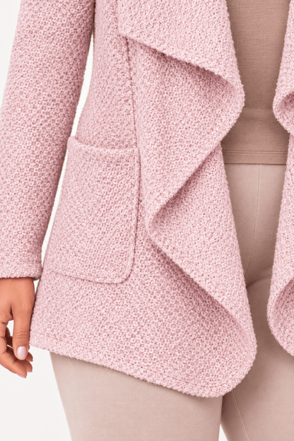Detail van breisel en afwerking van cardigan met insteekzakken.