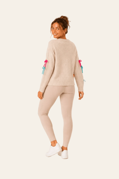 Pull femme à col rond, manches longues et petits nœuds décoratifs colorés