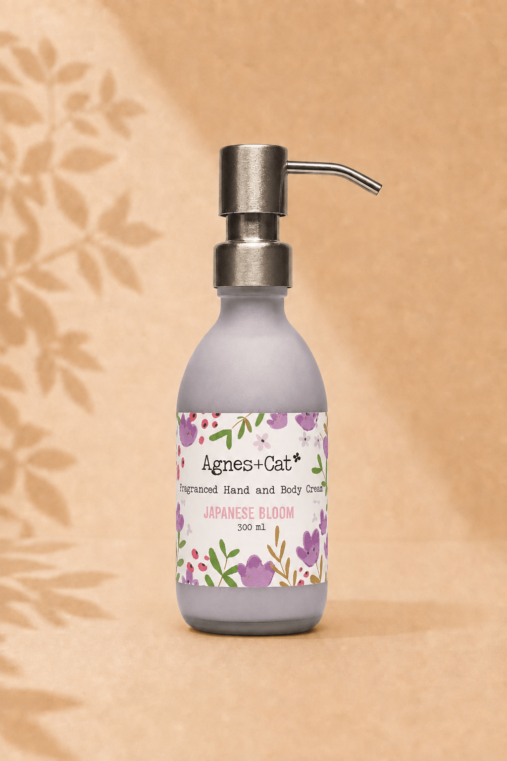 Hand en bodycrème met Japanse bloesemgeur in grijze fles met handpomp