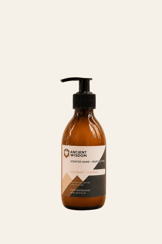  Hand en bodylotion met kokos en citroen geur van 300ml in een bruine transparante fles met zwarte handpomp als productfoto