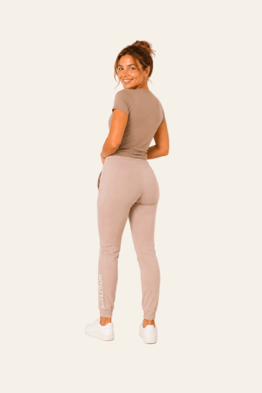 Sporty women's jogging bottoms with high waist and elasticated cuffs
