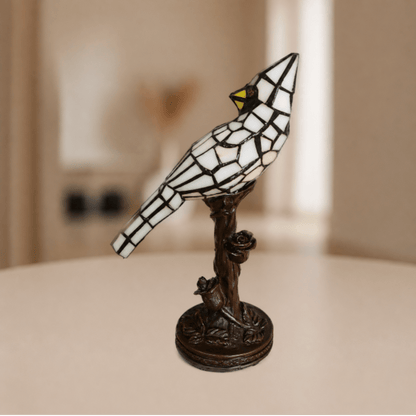 Tiffany vogellamp met beigekleurige glas-in-loodveren en decoratieve boomtakvoet