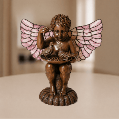 Tiffany engellamp met rozekleurige glas-in-loodvleugels en bronstintige engelfiguur