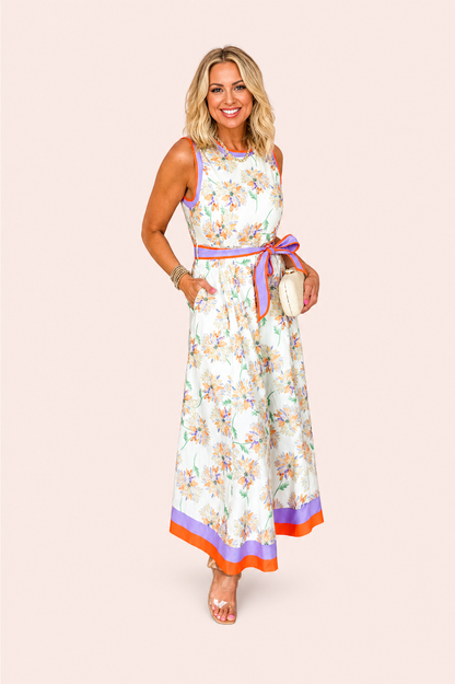 Witte mouwloze maxi jurk met bloemenprint en ceintuur