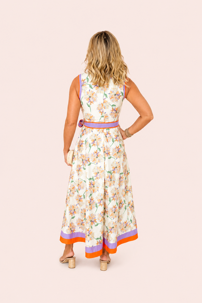 Witte mouwloze maxi jurk met bloemenprint en ceintuur