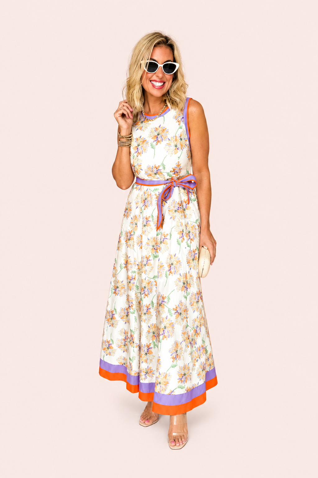 Witte mouwloze maxi jurk met bloemenprint en ceintuur